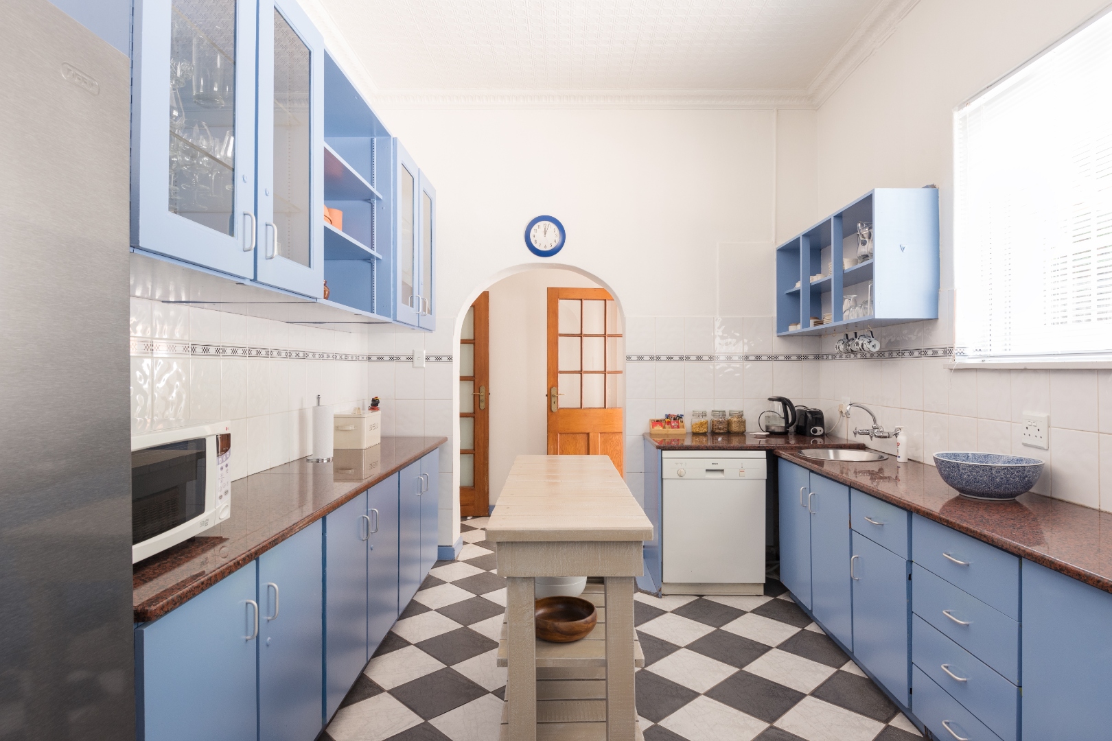 Kitchen island and checkerboard floor