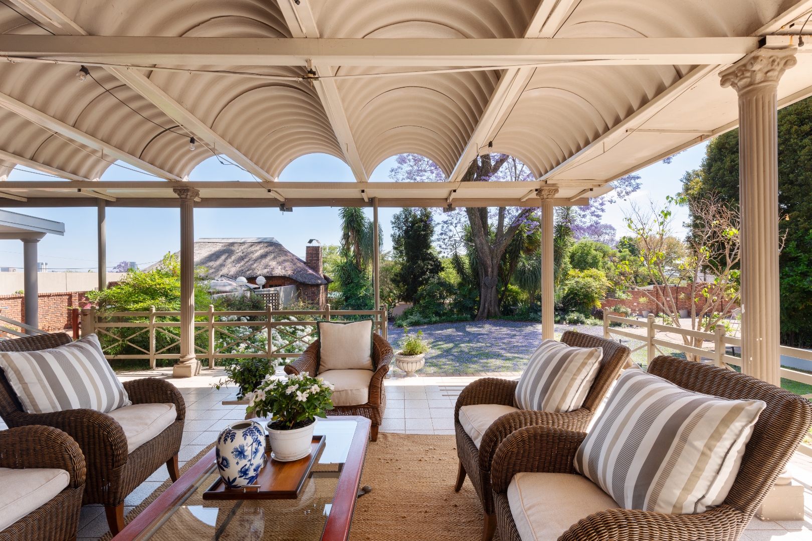 Covered patio lounge with garden views